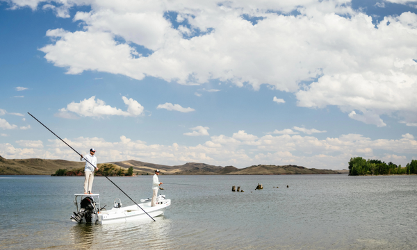 man on boat for trout fishing