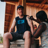 man wearing flats grail t-shirt  while getting painted on skin